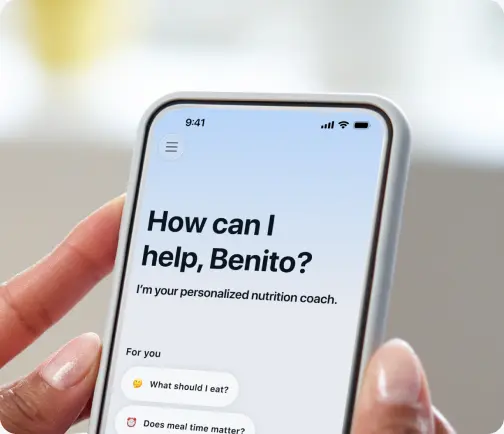 The MyFitnessPal app showing the AI Nutrition Coach chat asking how it can help.